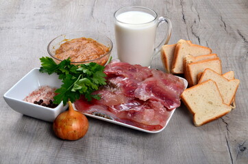 Ingredients for fish cutlets, meatball or fish croquettes. Fresh fish meat, bread, milk, onion, fish caviar and parsley, salt. Copy space