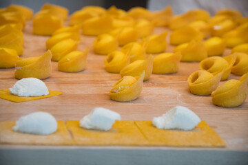 Fototapeta na wymiar Cheese tortellinis being handmade in Bologna