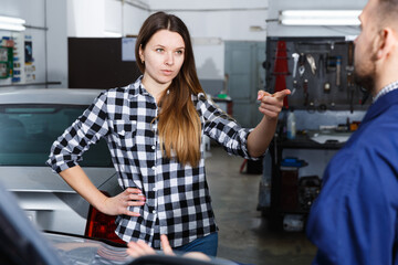 Female is dissatisfied of tire replacement of her car in spring in workshop.