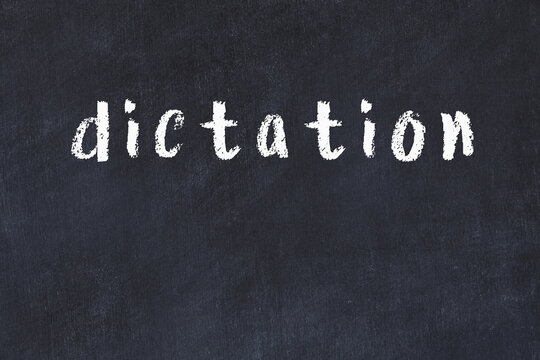 Black chalkboard with inscription dictation on in