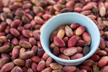 fresh pistachio in blue bowl