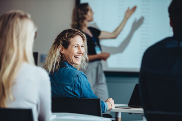 Business woman smiling during a presentation