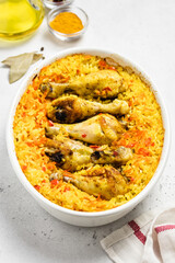 Curried spicy chicken rice casserole in baking dish. Space for text.