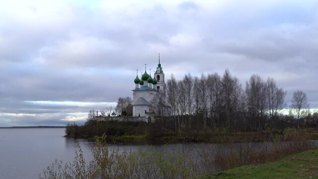 Church of the Holy Trinity in the village of Dievo Gorodishche. Early gloomy morning on the Bank of the Volga river in Yaroslavl region, Russia.