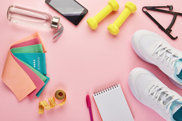 Creative flat lay of sport and fitness equipments.