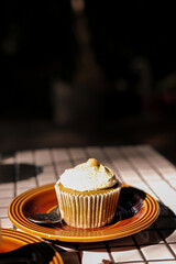 Coffee cupcake on plate, soft focus