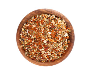 Mix of herbs, spices and dry tomatoes in wooden bowl, isolated on white background. Natural organic food seasoning. Top view.