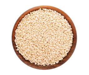 Sesame seeds in wooden bowl, isolated on white background. Organic dry sesame seeds. Top view.