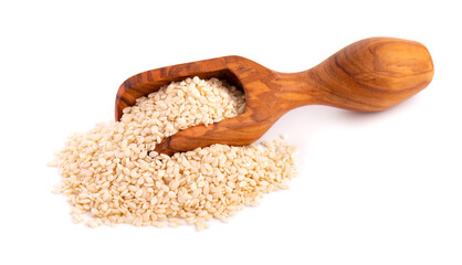 Sesame seeds in wooden scoop, isolated on white background. Organic dry sesame seeds.