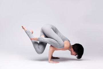 young beautiful woman yoga posing - 388567063