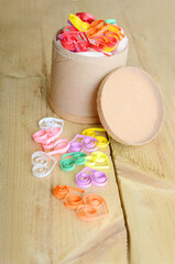 Paper quilling,colorful paper hearts on wooden