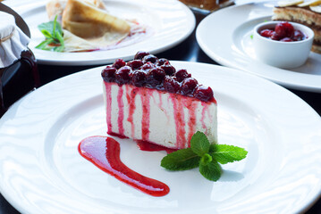 Strawberry jam cake on a white plate.
