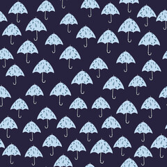 Fototapeta na wymiar Little random blue umbrella silhouettes season seamless pattern. Simple fall ornament on navy blue background.