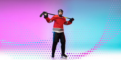 Youth. Young male hockey player with the stick on pink-blue background in neon light. Neoned modern artwork, cover, flyer designed. Concept of sport, healthy lifestyle, motion, movement, action.