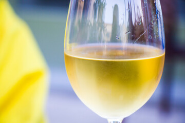 White wine in wineglass close-up background