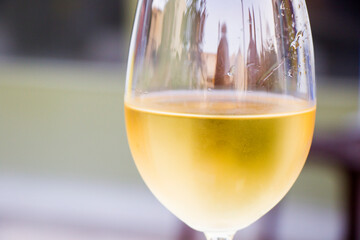 White wine in wineglass close-up background