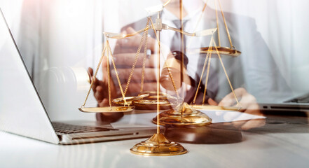 Business and lawyers discussing contract papers with brass scale on desk in office. Law, legal services, advice, justice and law concept picture with film grain effect