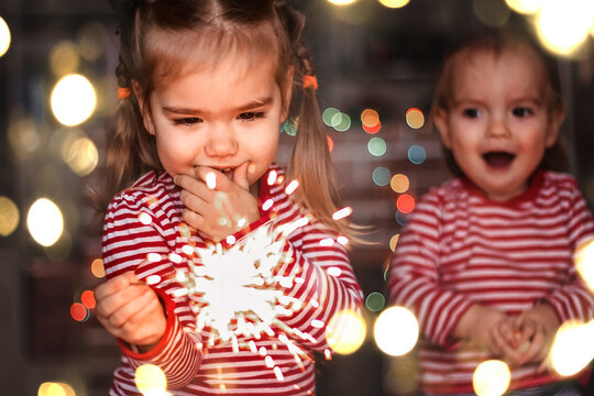 Family Holidays At Home. Two Happy Kids Holding Burning Sparkler, Indoor Lifestyle