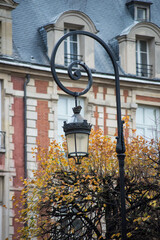 closeup of vintage street light in vosges square in Paris