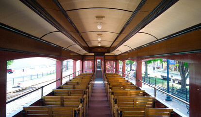 Antique Open Air Passenger Car Interior with Wooden Seats