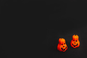 orange pumpkin candles with Jack's face on a black background. preparation for the Halloween holiday