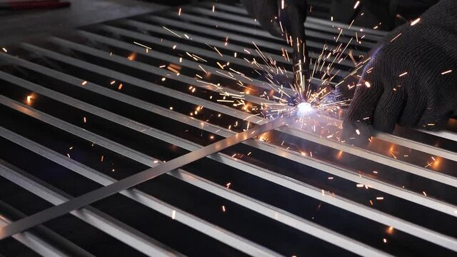 Close-up work with metal steel and iron using a welding machine