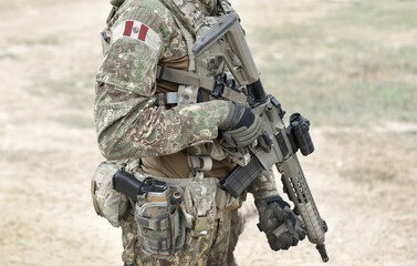 Soldier with assault rifle and flag of Peru on military uniform. Collage.