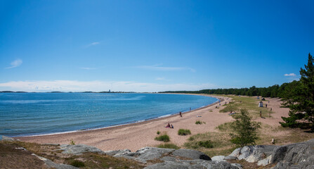 Sunny sand beach at seaside of Hanko town in southmost part of Finland