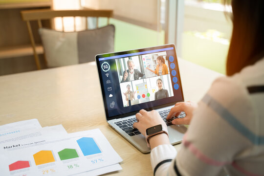 Businesswoman and Business team in video conference for protection covid-19.woman watching laptop webinar video course at home office.Webinar,social distancing,e learning and seminar online Concept.