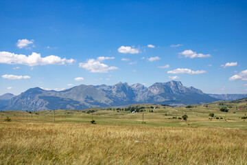 Fantastic mountains of Montenegro. Picturesque mountain landscape of Durmitor National Park, Montenegro, Europe, Balkans, Dinaric Alps, UNESCO World Heritage Site.  Power lines