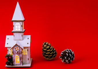 New Year's wooden house on a red background