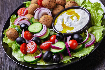 Platter of falafels with vegetables with tzatziki