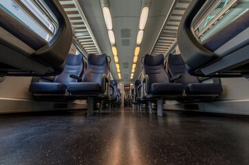 View of the interior of a train with empty seats