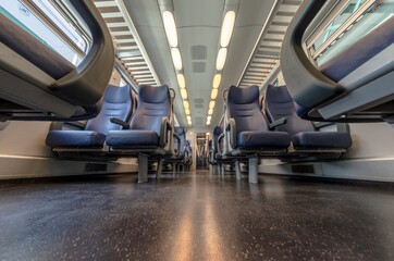 View of the interior of a train with empty seats