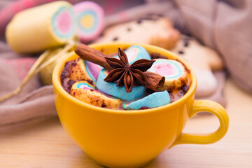 cup of chocolte with marshmallows and gingerbread man and gingerbread cookie on bokeh background. Christmas banner.