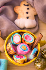 cup of chocolte with marshmallows and gingerbread man and gingerbread cookie on bokeh background. Christmas banner.