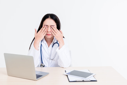 Portrait images of Asian attractive woman doctor is stressed and tired from hard work to take care of patients, whit white background, to people and health care concept.