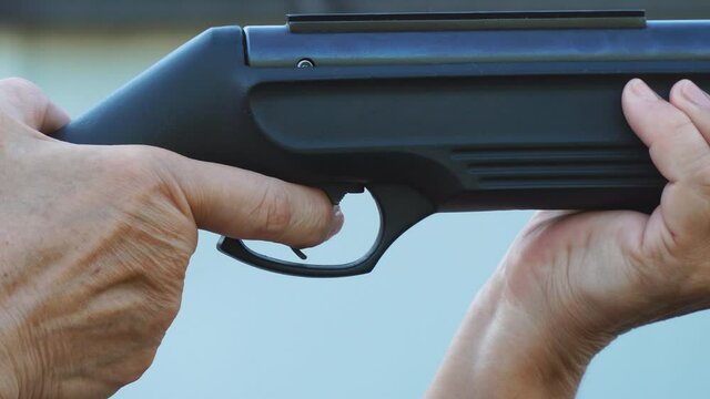 Finger on the rifle trigger. Shooting from a gun
