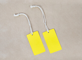 Two yllow paper label tag. Mock up of label branding clothing.