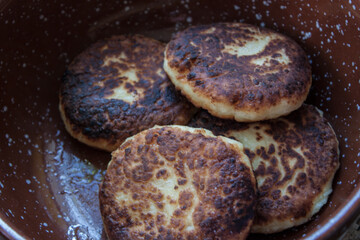 Cheesecakes or Syrniki on a plate. Russian and Ukrainian Cuisine