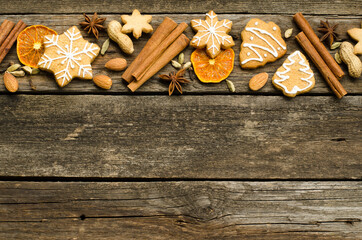 Christmas frame made of gingerbread fir , spices, cinnamon, star anise, cardamom, orange. Christmas wallpaper. Flat lay, top view, copy space. rustic