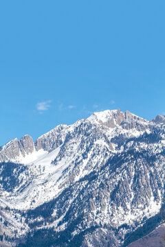 The Wasatch (Uinta) mountain range located along the east side of the Salt Lake valley (Utah). This peak is called Lone Peak.