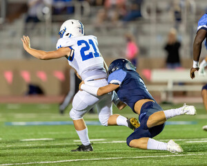 Fototapeta premium Football players displaying amazing athletic ability while making plays during a game