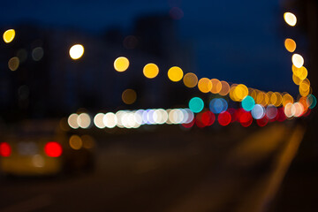 Defocused blur city lights at night abstract bokeh of street traffic