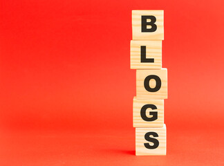 Wooden cubes with letters. Wooden cubes on a red background. Free space on the left.