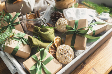 Christmas zero waste eco Care package,furoshiki gifts environmentally friendly gift wrapping craft paper fir branches, cozy winter winter evening Christmas Eve,ecological concept eco-friendly xmas