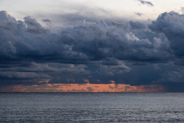 Dramatic clouds in a sunset light over the mediterranean sea