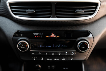 Obraz na płótnie Canvas Interior view of a modern new car. Climatronic or air conditioner system.