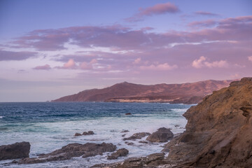Waves and sunset at the coastline of Fuerteventura