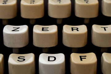 Keys of an old, dusty typewriter. Closeup, selective focus